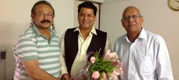 Ankur Datta and Kushal Das with Sarbananda Sonowal (centre)