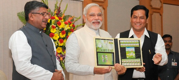 Prime Minister of India Narendra Modi releases commemorative postage stamps on the 2014 FIFA World Cup