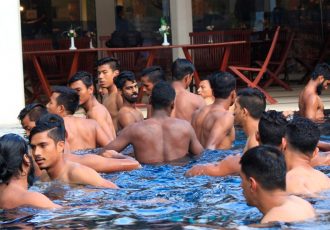 Indian national football team players relaxing in the pool.