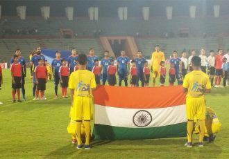 The Indian national team singing the national anthem