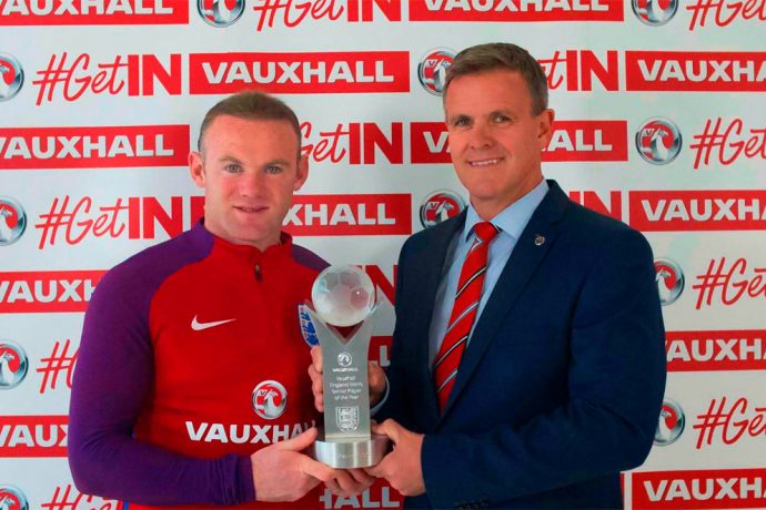 Wayne Rooney receives his Vauxhall England Player of the Year award from Vauxhall Head of Sponsorship and Events Andrew Curley.