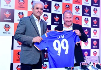 FC Goa Head Coach Zico presenting a jersey to Jaydev Mody