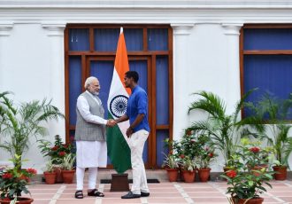 Indian Prime Minister Narendra Modi and Indian national football team goalkeeper Subrata Paul.