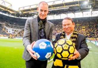 Borussia Dortmund's Carsten Cramer and Bangkok Airways President Puttipong Prasarttong-Osoth at Signal Iduna Park in Dortmund, Germany. (Photo courtesy: Bangkok Airways)