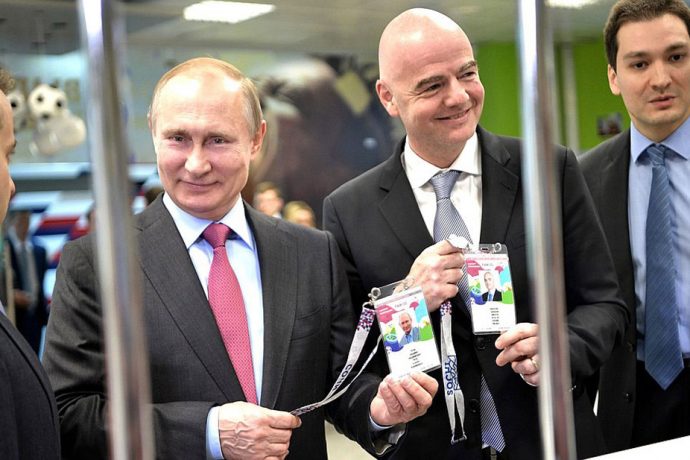 The President of the Russian Federation Vladimir Putin and FIFA President Gianni Infantino with the 2018 FIFA World Cup FAN ID. (Photo courtesy: kremlin.ru)