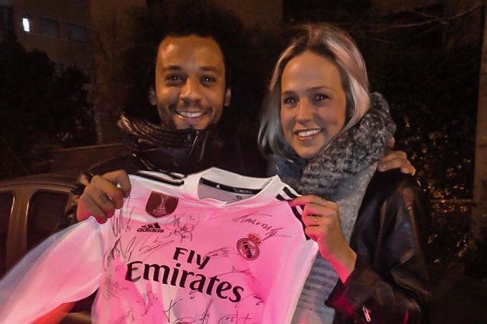 Brazil and Real Madrid superstar Marcelo and Bella Linden with the original autographed Real Madrid jersey. (Photo courtesy: Bella Linden)