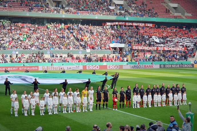 VfL Wolfsburg and SC Freiburg moments before the 2019 DFB-Pokal der Frauen (German Women's Cup) final at the RheinEnergieSTADION in Cologne. (© CPD Football)