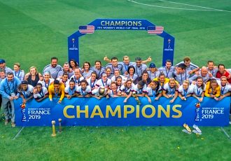 United States players and officials celebreating their fourth FIFA Women's World Cup title.