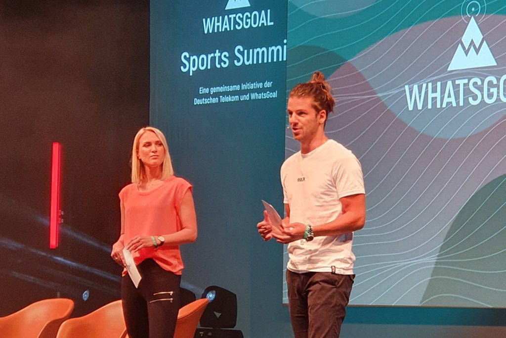 Ruth Hofmann (Sport1) and Riccardo Basile (Sky Sports) presenting the WhatsGoal Sports Summit 2019 in Düsseldorf, Germany. (© CPD Football)