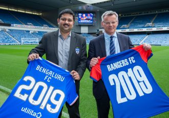 Bengaluru FC CEO, Mandar Tamhane exchanges club shirts with Rangers FC Managing Director, Stewart Robertson at the Ibrox Stadium in Glasgow after the clubs announced a partnership, on Friday. (Photo courtesy: Bengaluru FC)