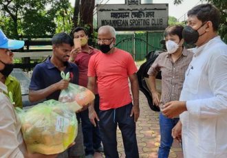 Mohammedan Sporting Club officials distributing food aid bags to help the groundsmen of Kolkata Maidan. (Photo courtesy: Mohammedan Sporting Club)