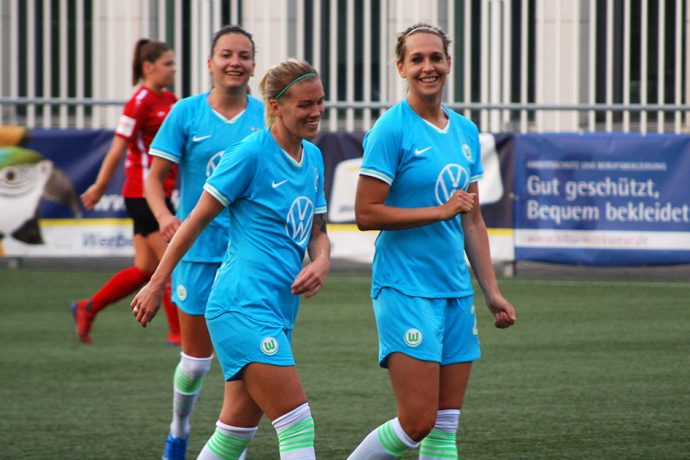 VfL Wolfsburg's Lara Dickenmann (center) celebrating a goal with her teammates Lena Goessling (right) and Joelle Wedemeyer (left). (© CPD Football)