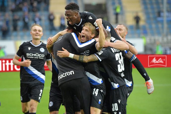 DSC Arminia Bielefeld players celebrate a goal in the Bundesliga and a strong partnership between their club and the Melitta Group. (Photo courtesy: Melitta Group Management GmbH & Co. KG)